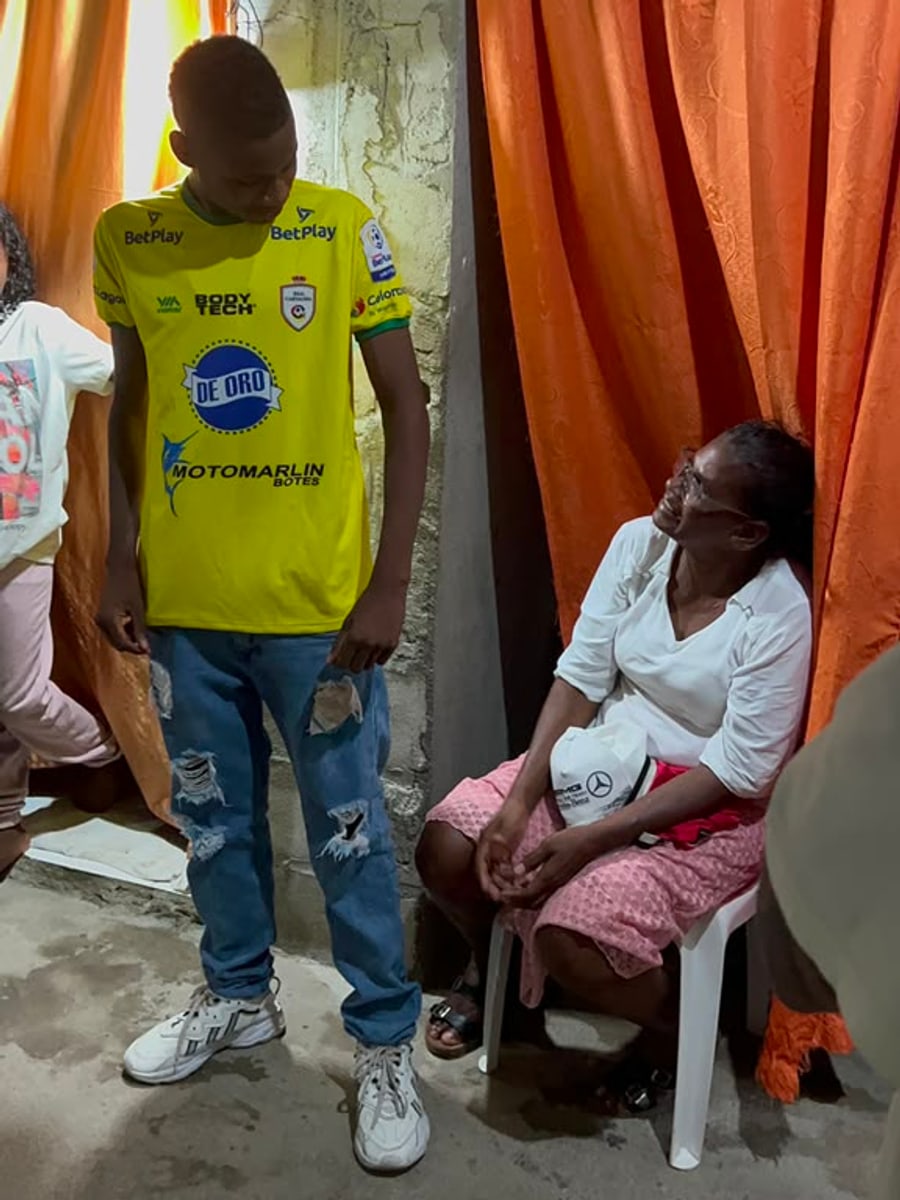 Juan Contreras with his mother at their home in Fundación, Magdalena.